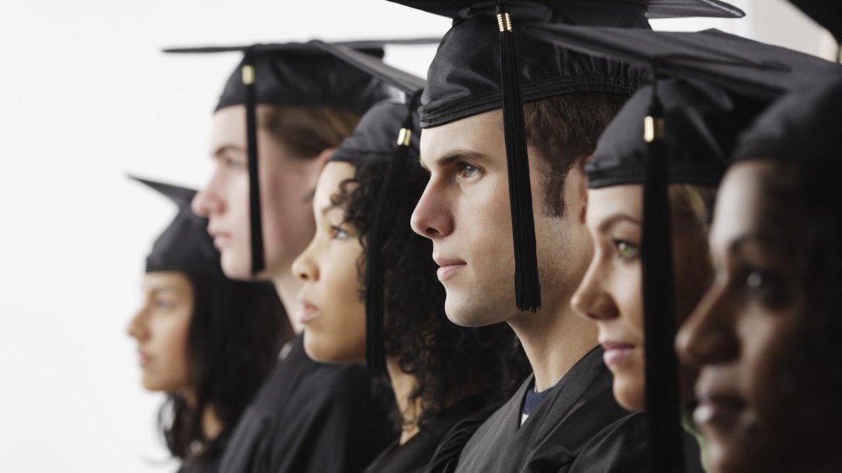 Graduates in Cap and Gown --- Image by © Royalty-Free/Corbis